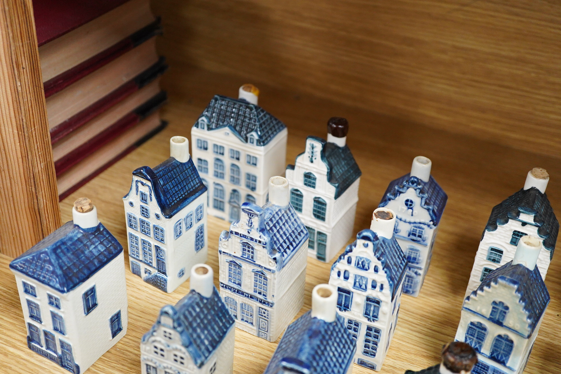 A collection of twenty seven KLM Delft blue miniature houses presented to Business class passengers together with a Delft jug - 20.5cm high